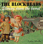 The Blockheadsin albumin "Looking Down The Barrell" etukannessa piirros nuorista pikkulapsista, jotka ovat valoisassa ja värikkäässä puutarhassa nurmikolla. Taustalla kukkia ja kasviksia. Yläosassa mustalla värillä yhtyeen nimi, jonka alla valkoise