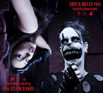 Santa Hates Youn uuden "Crucifix Powerbomb" -albumin etukannessa ylösalaisin katossa riippvua mustahiuksinen nainen ja hänen oikealla puolellaan valkoiseksi kasvonsa kalkinnut mies, joka irvistelee suurennuslasi suunsa edessä ja valkoiset silmät hohta