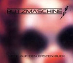 Hämärä ja epätarkka valokuva klovnin naamavärkistä. Kuvan yläosassa on mustalla värillä Blitzmaschinen logo. Alaosassa mustalla värillä lukee "Liebe auf den Ersten Blick".