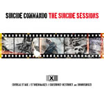 Valkoinen pohjaväri, jonka yläosassa mustalla värillä lukee Suicide Commando vasemmalla ja oikealla "The Suicide Sessions" ilman lainausmerkkejä. Kuvan keskellä filminauhaa, jossa valokuvia.
