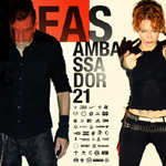 Valokuva mustiin pukeutuneesta miehestä ja naisesta. Mies vasemmalla, nainen oikealla. Kuvan keskellä lukee mustalla "FAS" ja Ambassador21.