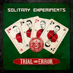 "Trial and Error" -MCD:n etukannessa neljä pelikorttia tummanvihreää taustaa vasten. Kuvan yläosassa Solitary Experiments -logo.