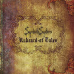 Symbiotic Systemsin logo vanhaa, likaista ja ruskeaa taustaa vasten mustalla värillä. Logon alla lukee goottilaisin kirjaimin Unheard-of Tales.